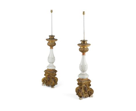 PAIR OF CONTINENTAL GILTWOOD AND CERAMIC ALTAR CANDLESTICKS 19TH CENTURY with foliate carving, the white ceramic columns with