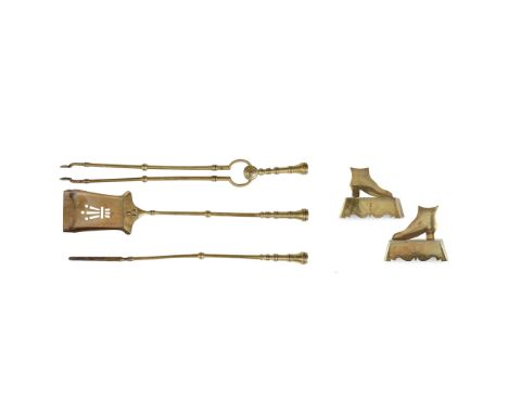 SET OF THREE BRASS FIRE IRONS LATE 19TH/ EARLY 20TH CENTURY comprising a shovel, a poker, and a set of tongs, with ring-cast 