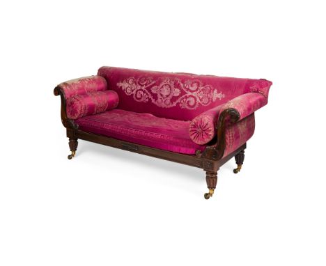 Y LATE REGENCY ROSEWOOD SOFA SECOND QUARTER 19TH CENTURY with a low upholstered back and outswept arms with acanthus carved f