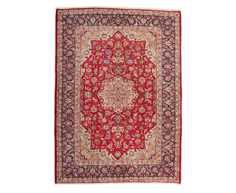 TABRIZ CARPET NORTHWEST PERSIA, MODERN the red field with cream cusped medallion, light blue and cream spandrels, within indi