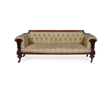 REGENCY MAHOGANY SOFA EARLY 19TH CENTURY the low button-upholstered back and stuffover seat flanked by scroll arms with carve