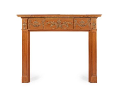 LATE GEORGIAN PINE AND GESSO FIRE SURROUND EARLY 19TH CENTURY the moulded inverted breakfront shelf above a frieze with entwi
