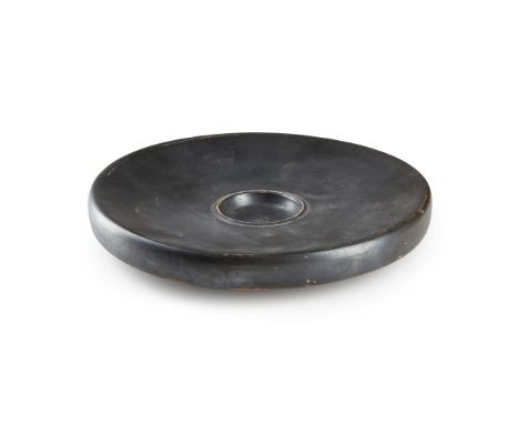 ATTIC BLACK GLAZED FISH PLATE GREECE, MID 4TH CENTURY B.C. fired ceramic, with a black glaze, standing on a ring base w ith a