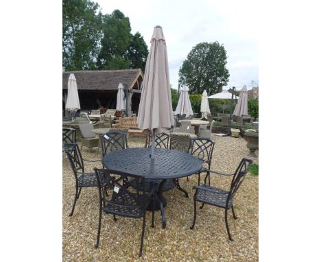A Bramblecrest Florence black aluminium table, a lazy susan, six Marbella black aluminium chairs, a 2.5 m sand parasol and a 