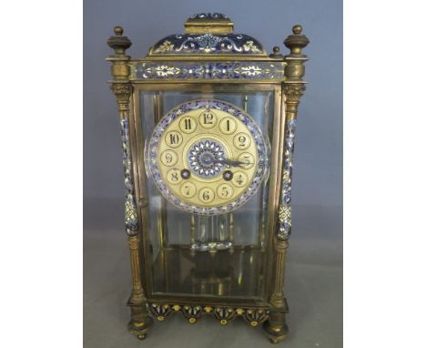 A good quality four glass gilt brass French Champleve enamel mantel clock with a 10cm dial, having Roman numerals twin barrel