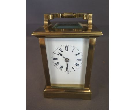 A brass carriage clock 13cm tall in working order