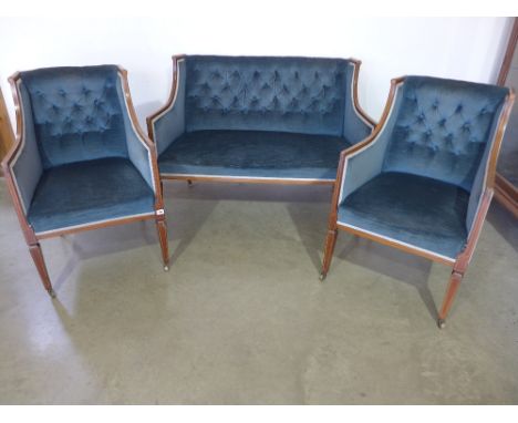 A mahogany and inlaid suite of three pieces consisting of two seater button back settee upholstered raised on square tapering