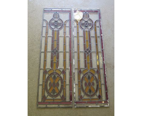 Two stained glass panels - 99 cm x 30 cm 
Condition report: Some damage to top of one panel
