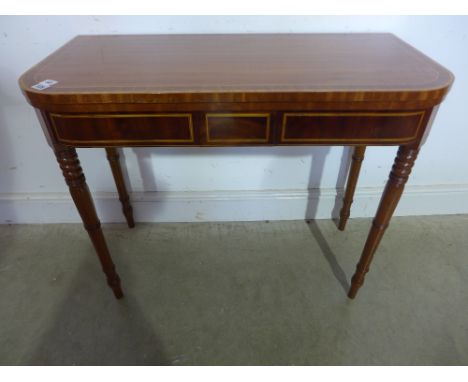 A Regency style mahogany and satinwood fold over card table on turned and pointed legs - Height 73 cm x 90 cm x 43 cm 