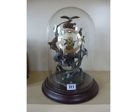 A modern quartz clock - Zoological theme all mounted under glass dome on plinth - 34cm tall - working