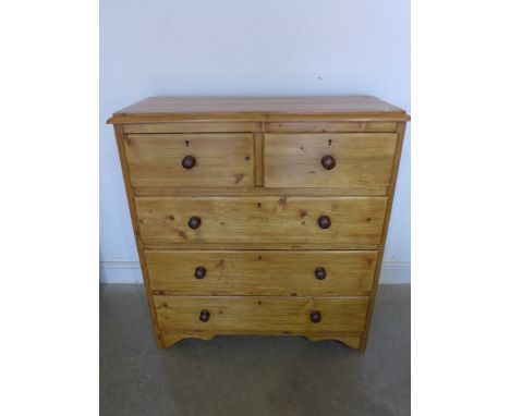 A 19th century pine chest of two short over three long drawers with original wood knobs stripped and waxed - Height 1.11 m x 