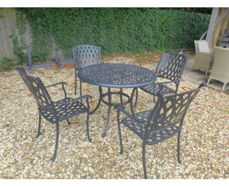 A Bramblecrest Naples black aluminium table with four Etna black aluminium chairs, and a 2.5 m natural parasol 