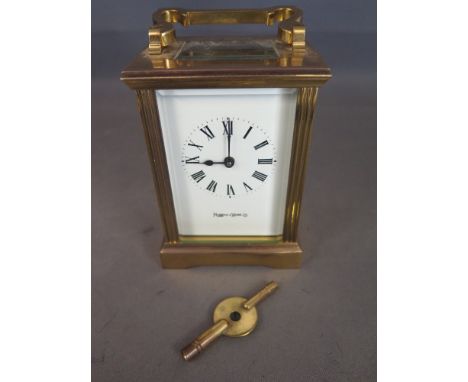 A modern Mappin & Webb carriage clock/timpiece - glazed all sides and top signed white enamel face 
Condition report: In runn