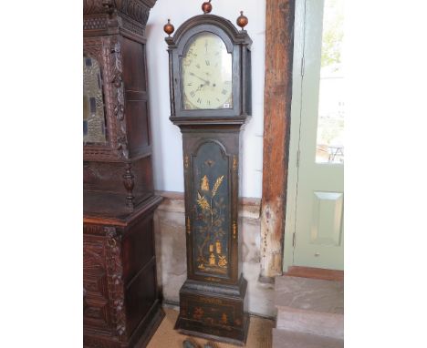 An 8 day longcase clock with a painted arched dial with strike silent, a seconds hand and calendar in a decorated case with w