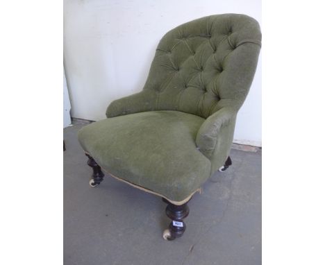 A Victorian button back nursing chair on turned front legs