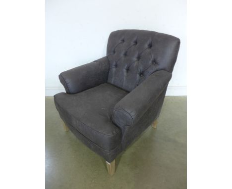 A Libra design faux leather button back armchair 
