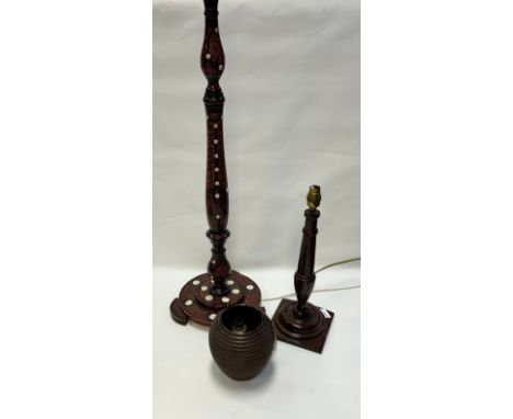 A lacquered and mother of pearl inlaid table lamp together with an antique style table lamp and a wooden carved table lamp