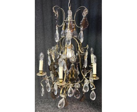 A reproduction gilded and crystal cage chandelier