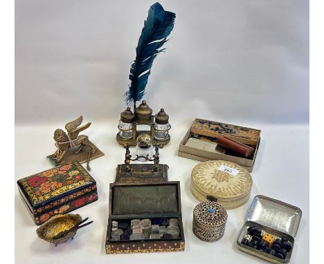 A mixed lot to include glass stamps, letter stamper with stamps, silver topped glass ink pot, lidded trinket boxes, brass myt