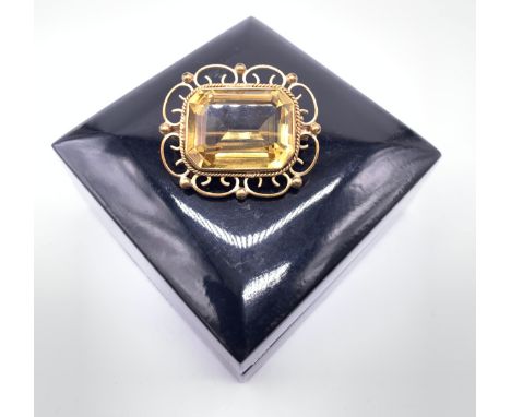 9ct yellow gold and citrine set broochThe gold scrolling and ball frame with rectangular cut citrineWeight - 9.16g