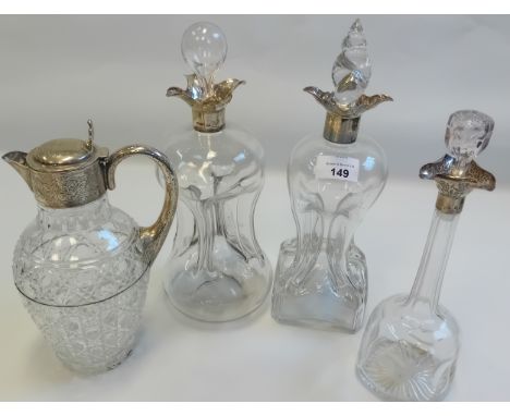 Three Silver collared Victorian Glass Decanters together with silver necked crystal claret jug.