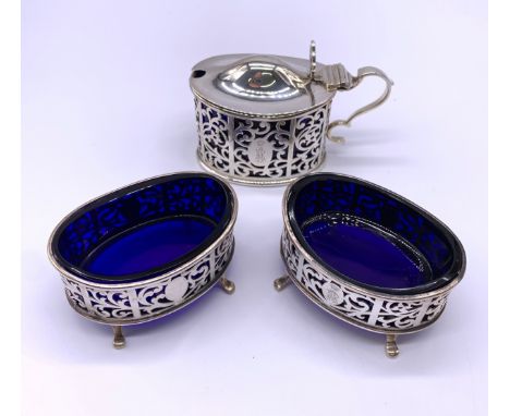 Significant silver condiment set with scrolled work and original blue glass liners Wakely & Wheeler (James Wakely & Frank Cla