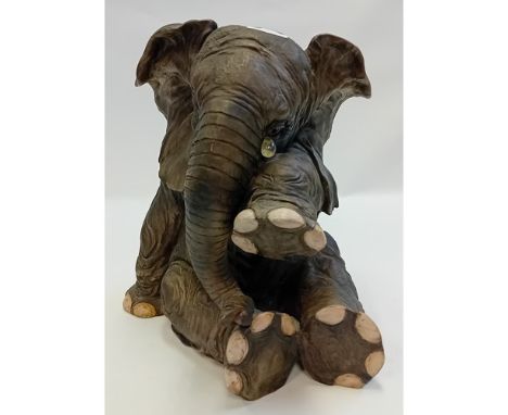 Vintage crying elephant sitting sculpture