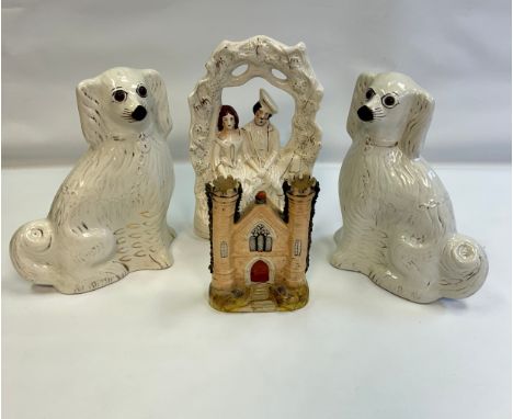 A lot of Mid 19th Century Staffordshire Seated Spaniel fire dogs, together with Staffordshire Courting couple, Staffordshire 