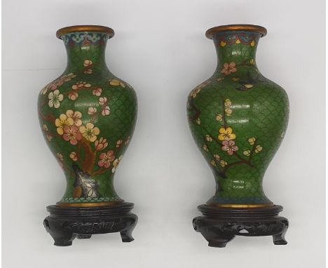 Vintage Small Cloisonné Enamel Vases with floral design standing on original Chinese carved hardwood base stands.