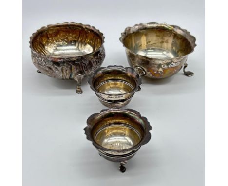 Two silver [London] three footed bowls together with two [Birmingham] small three footed bowls [145.84g]