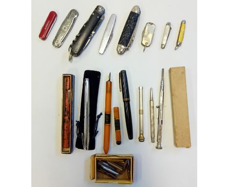 Collection of pens and foldable pocket knives