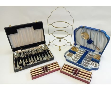 Two canteen of plated cutlery, metal cake stand and knife sets