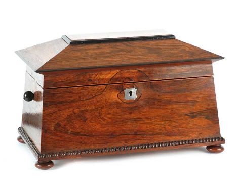 ROSEWOOD TEA CADDY WITH MOTHER OF PEARL ESCUTCHEON AND BOW FEET, FITTED WITH TWO BOXES INSIDE.HEIGHT: 10 INCHES WIDTH: 15 INC