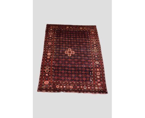 Kurdish carpet, north west Persia, second half 20th century, 8ft. X 5ft. 9in. 2.44m. X 1.75m.  All over octagons with hooked 