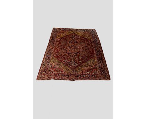 Heriz carpet, north west Persia, circa 1950s, 12ft. 6in. X 9ft. 4in. 3.80m. X 2.85m. Note the pale gold spandrels. Robust han