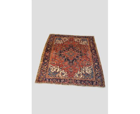 Heriz carpet, north west Persia, early 20th century, 10ft. 2in. X 8ft. 6in. 3.10m. X 2.59m. Overall wear; slight losses to en