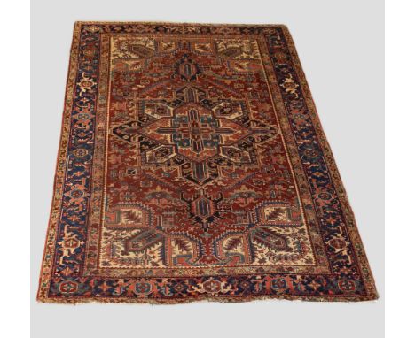 Heriz carpet, north west Persia, circa 1920s, 11ft. 1in. x 7ft. 8in. 3.38m. x 2.34m. Overall wear; slight losses to ends. Goo