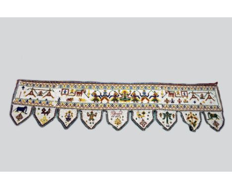 Rajasthan silk embroidered toran, north west India, circa 1930s-40s,  134in. X 17in. 340cm. X 43cm. Embroidered with inscript