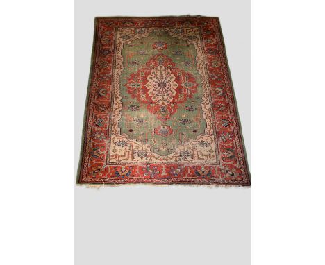 Ushak carpet with pale green field, west Anatolia, early 20th century, 9ft. 8in. X 6ft. 11in. 2.94m. X 2.11m. Overall wear, h