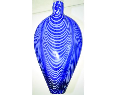 NAILSEA STYLE FLASK. 7ins long, flattened round bottom flask, blue glass with white enamelled swirls with pontil base. Very g