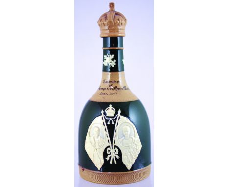 ANDREW USHER & CO COMMEMORATIVE DECANTER. 8.25ins tall, as previous lot but in green & beige glaze. Good. NR
