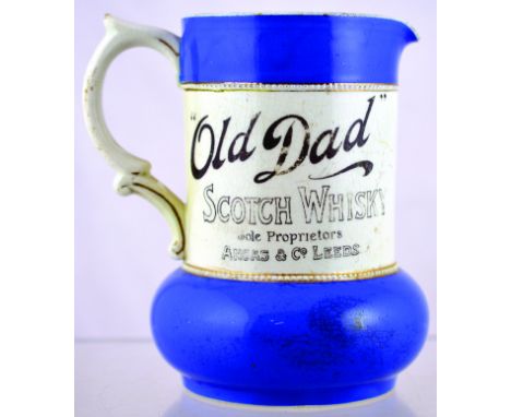 OLD DAD PUB JUG. 6ins tall, blue top & base, middle section white with black transfer OLD DAD/ SCOTCH WHISKY/ SOLE PROPRIETOR