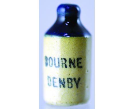 MINIATURE GINGER BEER BOTTLE. 7/8ins tall, st. shape, blue top, black print BOURNE/ DENBY. A fabulous and rare mini coloured 