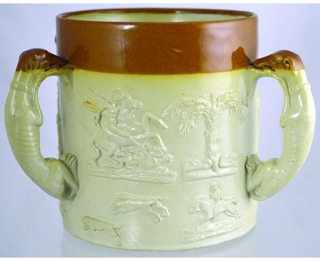 LARGE LOVING CUP. 7ins tall, brown top lower off white glaze, (3) greyhound handles with raised hunting motifs. St George & d