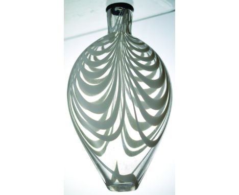 NAILSEA STYLE FLASK. 7.75ins long, flattened flask with black lip, clear glass with white enamelled swirls, pontil base. Very