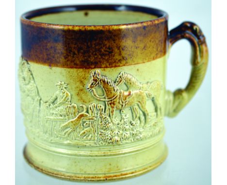 SALT GLAZE TANKARD. 5.5ins tall, brown top, lower tan salt glaze, greyhound handle with raised hunting scene (The Kill) horse