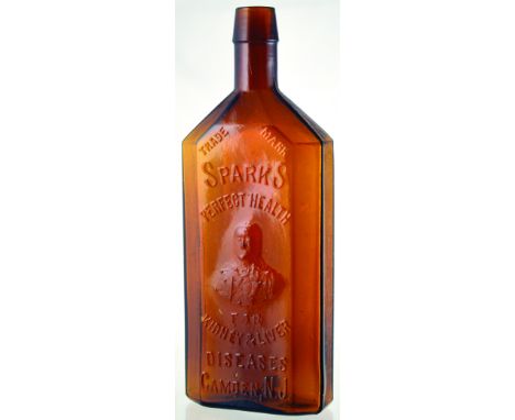 SPARKS KIDNEY & LIVER BOTTLE. 9.5ins tall, red/ amber glass rectangular shape, chamfered corners, sloping shouldered. Embosse