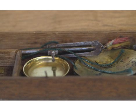 Wooden box of gold scales 