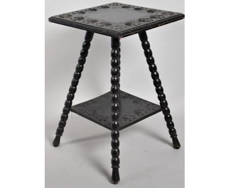 An Edwardian Bobbin Legged Two Tier Occasional Table with Carved Border to top and Stretcher Shelf, 62cms High 