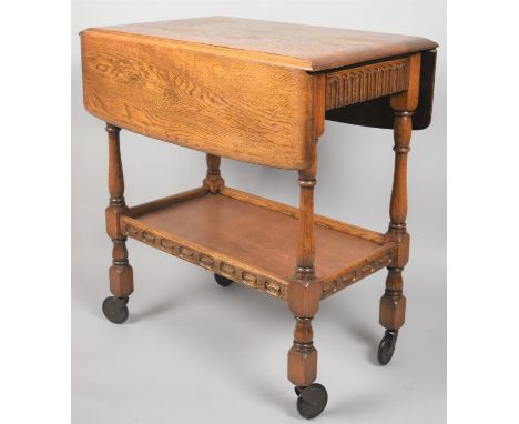 A Mid 20th Century Oak Drop Leaf Trolley with Galleried Stretcher Shelf, 68cms Wide 